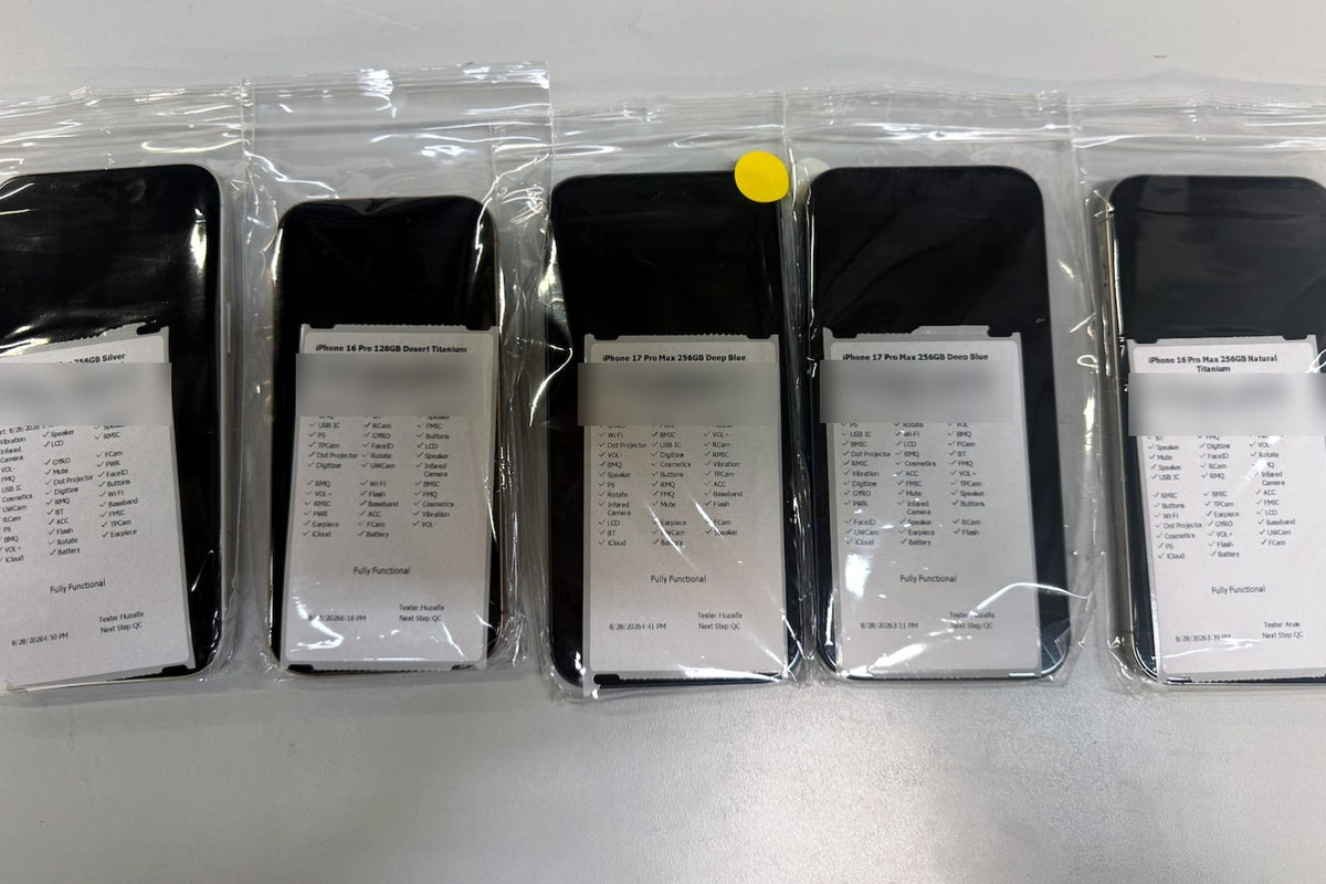 Tested phones bagged with their printed test reports showing every function checked